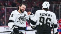 Los Angeles Kings defenseman Drew Doughty (8) has a laugh with left wing Andrei Kuzmenko (96) during warm-up before the game against the Montréal Canadiens at Bell Centre.