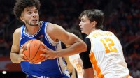 Duke forward Cameron Boozer (12) tries to get around Tennessee forward Cade Phillips (12) during a college basketball exhibition game.