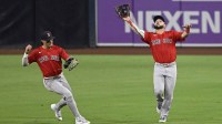 Boston Red Sox right fielder Wilyer Abreu (52) makes the catch on a ball hit by San Diego Padres right fielder Ramon Laureano (5) as Jarren Duran (16) looks on during the seventh inning against the San Diego Padres at Petco Park.