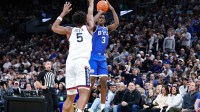 BYU's AJ Dybantsa, of Brockton, shoots a jump shot over the contest of UConn's Tarris Reed Jr. during a game at TD Garden in Boston, Massachusetts on Saturday, Nov. 15, 2025.
