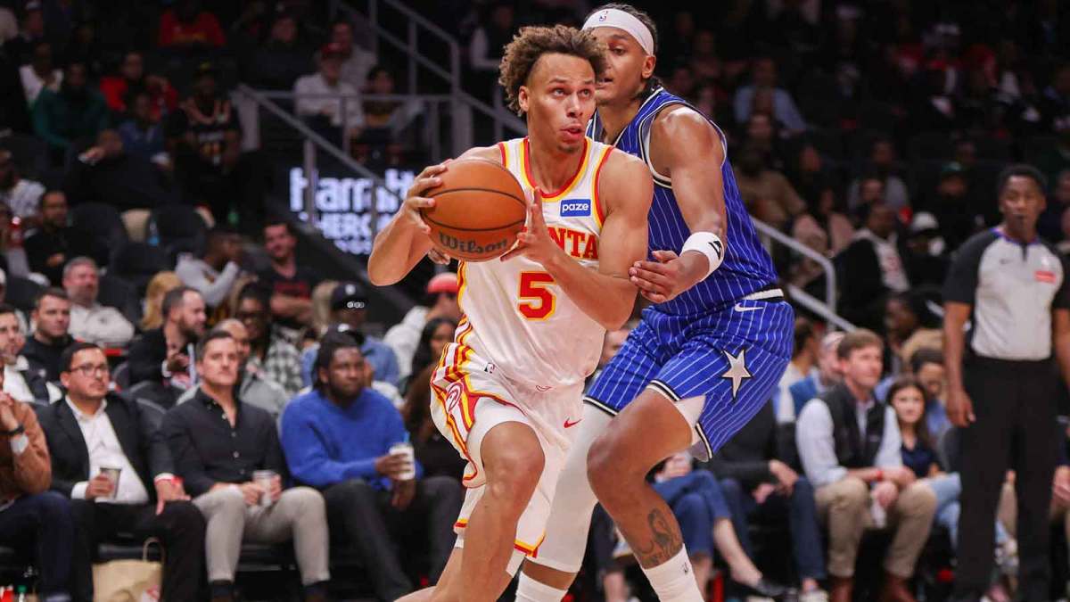 Atlanta Hawks guard Dyson Daniels (5) drives past Orlando Magic forward Paolo Banchero (5) in the third quarter at State Farm Arena.