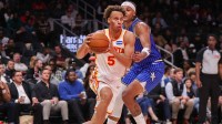 Atlanta Hawks guard Dyson Daniels (5) drives past Orlando Magic forward Paolo Banchero (5) in the third quarter at State Farm Arena.