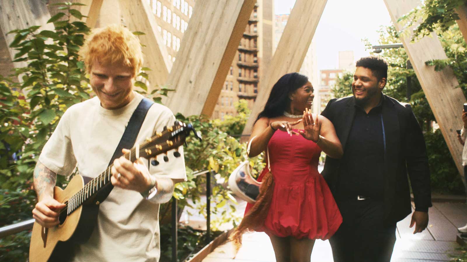 Ed Sheeran performing during a proposal.