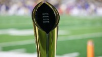 Nov 22, 2025; Atlanta, Georgia, USA; A view of the college football playoff national championship trophy on the sidelines of a game between the Georgia Tech Yellow Jackets and Pittsburgh Panthers in the fourth quarter at Bobby Dodd Stadium at Hyundai Field. Mandatory Credit: Brett Davis-Imagn Images