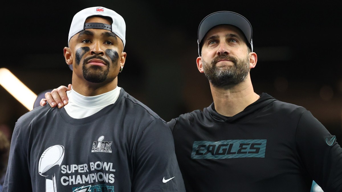 Philadelphia Eagles head coach Nick Sirianni and Philadelphia Eagles quarterback Jalen Hurts (1) on the podium after defeating the Kansas City Chiefs in Super Bowl LIX at Ceasars Superdome.
