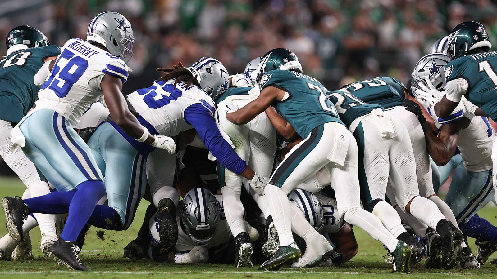 The Philadelphia Eagles execute a tush push for a first down against the Dallas Cowboys during the fourth quarter of the game at Lincoln Financial Field.