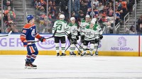 Dallas Stars players celebrate a goal as Edmonton Oilers left winger Andrew Mangiapane (88) skates past during the third period at Rogers Place.