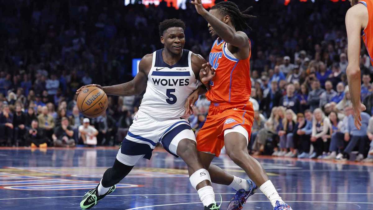Minnesota Timberwolves guard Anthony Edwards (5) moves to the basket beside Oklahoma City Thunder guard Cason Wallace (22) during the second half at Paycom Center.