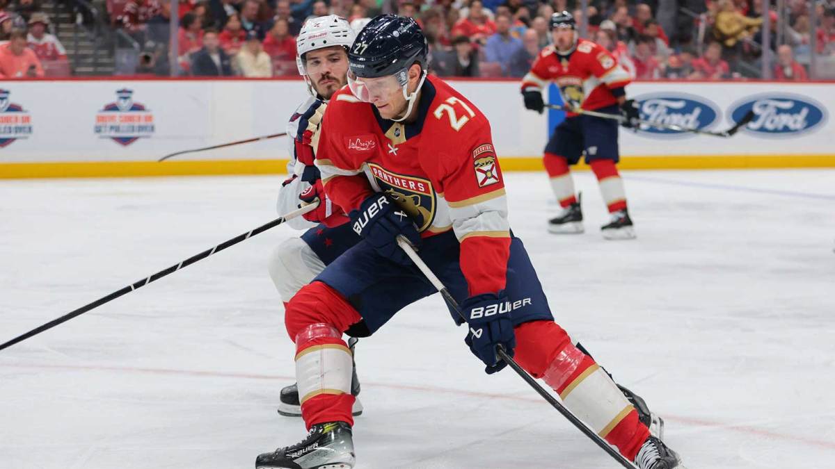 Florida Panthers center Eetu Luostarinen (27) moves the puck against the Washington Capitals during the second period at Amerant Bank Arena.