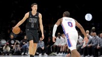 Brooklyn Nets guard Egor Demin (8) brings the ball up court against Philadelphia 76ers guard Tyrese Maxey (0) during the third quarter at Barclays Center.