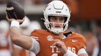 Texas Longhorns quarterback Arch Manning (16) warms up before a game against the Vanderbilt Commodores at Darrell K Royal-Texas Memorial Stadium.