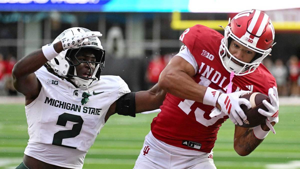 Indiana Hoosiers wide receiver Elijah Sarratt (13) catches a pass for a touchdown against Michigan State Spartans defensive back Aydan West (2) during the second half at Memorial Stadium.