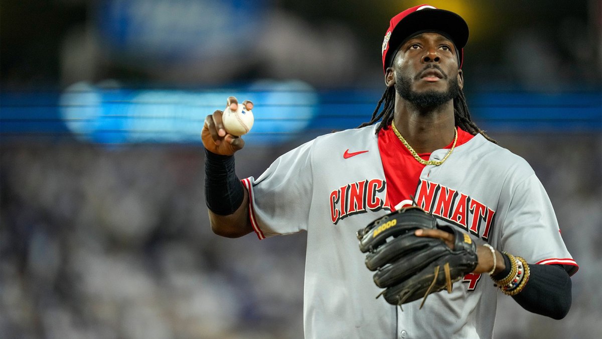 Cincinnati Reds shortstop Elly De La Cruz (44) throws a ball into the crowd after the second inning of the MLB National League Wild Card Game 2 between the Los Angeles Dodgers and the Cincinnati Reds at Dodger Stadium in Los Angeles on Wednesday, Oct. 1, 2025. The Reds were eliminated from the postseason with an 8-4 loss to the reining World Series Champions La Dodgers.