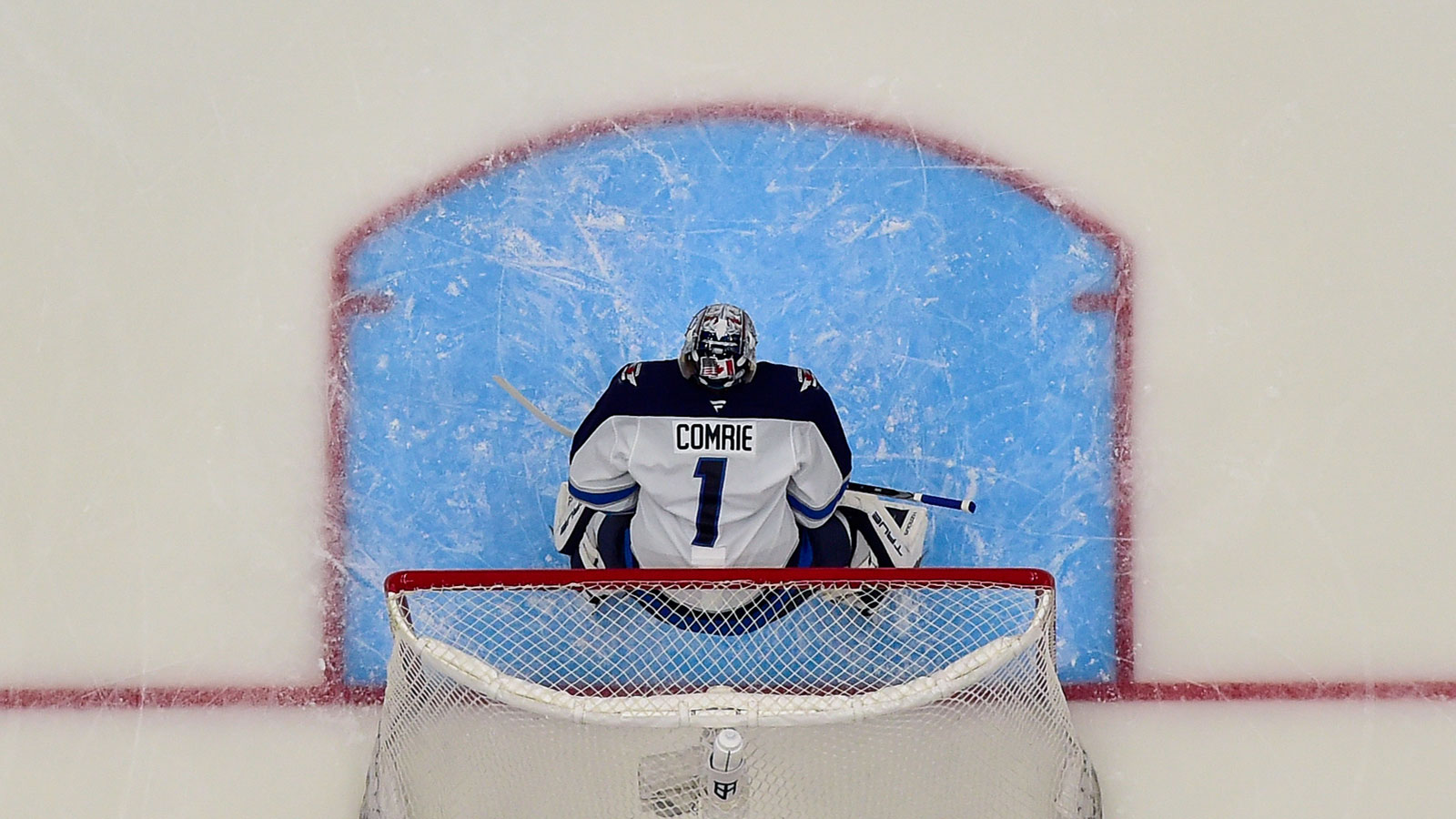 Winnipeg Jets goaltender Eric Comrie (1) relieves goaltender Connor Hellebuyck (37) in net to start the third period in game six of the first round of the 2025 Stanley Cup Playoffs against the St. Louis Blues at Enterprise Center.