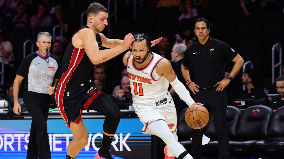 New York Knicks guard Jalen Brunson (11) drives to the basket past Miami Heat forward Nikola Jovic (5) during the fourth quarter at Kaseya Center.