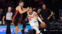 New York Knicks guard Jalen Brunson (11) drives to the basket past Miami Heat forward Nikola Jovic (5) during the fourth quarter at Kaseya Center.