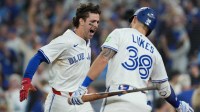 Toronto Blue Jays third baseman Ernie Clement (22) reacts after scoring a run against the Los Angeles Dodgers in the sixth inning for game seven of the 2025 MLB World Series at Rogers Centre.
