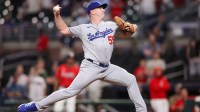 Los Angeles Dodgers relief pitcher Evan Phillips (59) throws a pitch against the Atlanta Braves in the ninth inning at Truist Park.