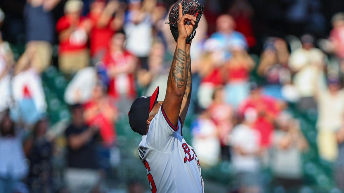 Atlanta Braves pitcher Raisel Iglesias (26) celebrates a victory against the Pittsburgh Pirates during the ninth inning at Truist Park.