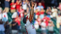 Atlanta Braves pitcher Raisel Iglesias (26) celebrates a victory against the Pittsburgh Pirates during the ninth inning at Truist Park.