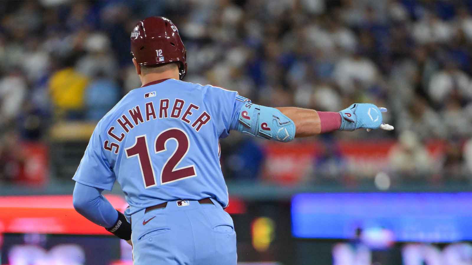 Philadelphia Phillies designated hitter Kyle Schwarber (12) celebrates after hitting a two run home run during the eighth inning against the Los Angeles Dodgers during game three of the NLDS round for the 2025 MLB playoffs at Dodger Stadium.