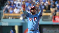 Philadelphia Phillies left fielder Kyle Schwarber (12) reacts after a double in the first inning against the Los Angeles Dodgers during game four of the NLDS round for the 2025 MLB playoffs at Dodger Stadium.