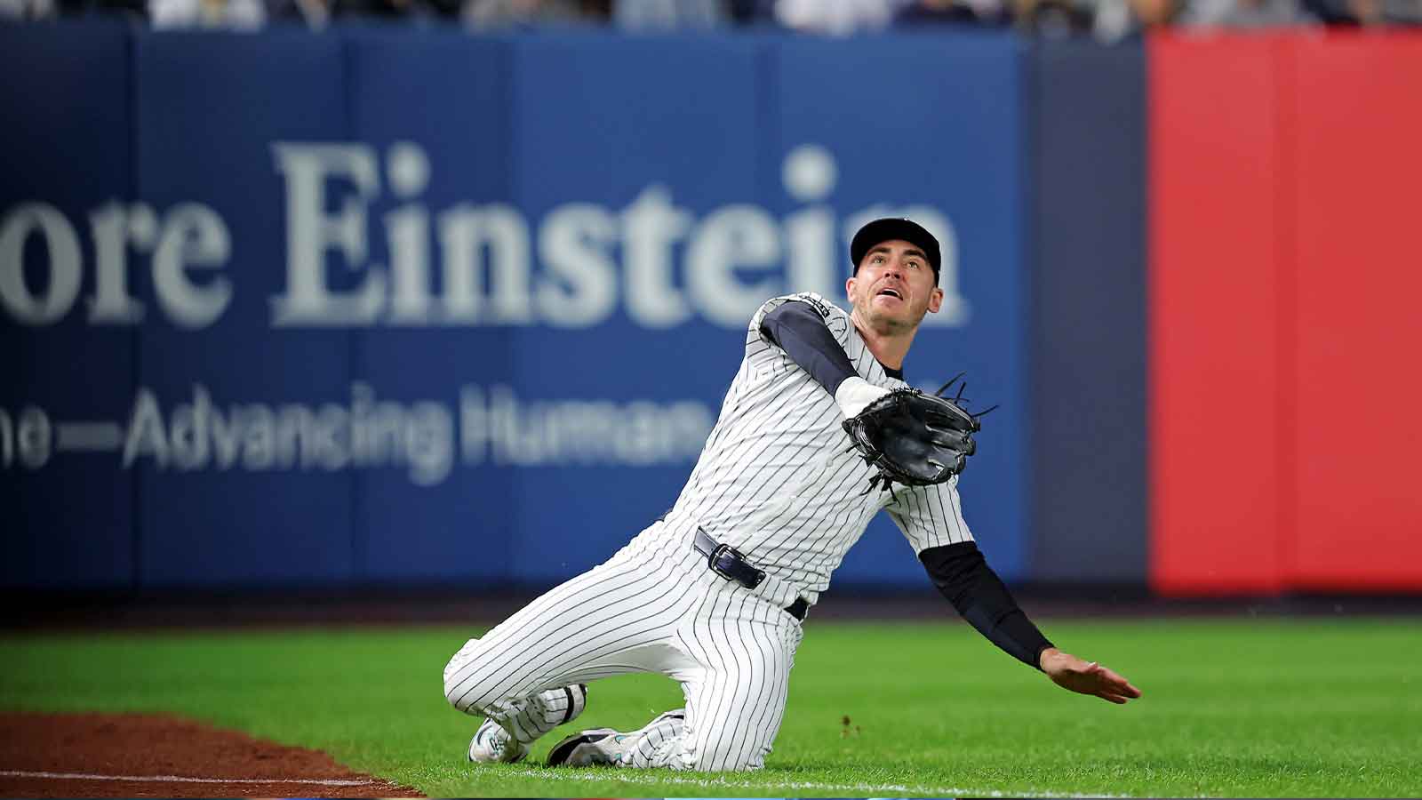 New York Yankees left fielder Cody Bellinger (35) slides to makes a catch during the first inning against the Toronto Blue Jays during game four of the ALDS round for the 2025 MLB playoffs at Yankee Stadium.