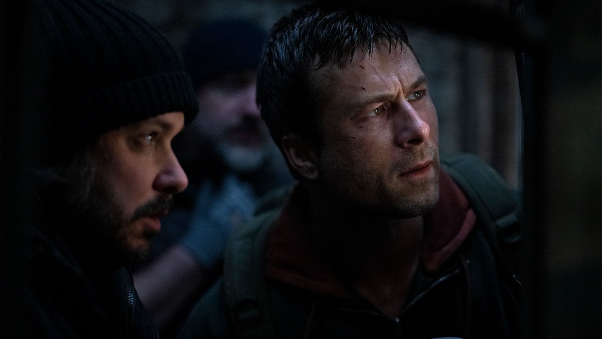 A still from The Running Man set of Edgar Wright and Glen Powell.