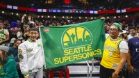 Fans hold a flag for the Seattle Supersonics during the fourth quarter of a game between the Utah Jazz and LA Clippers at Climate Pledge Arena.
