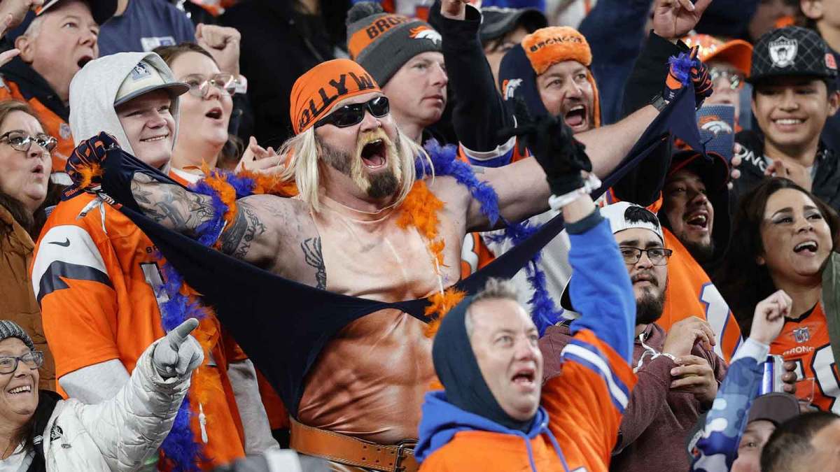 Broncos fans react during the second half at Empower Field at Mile High.