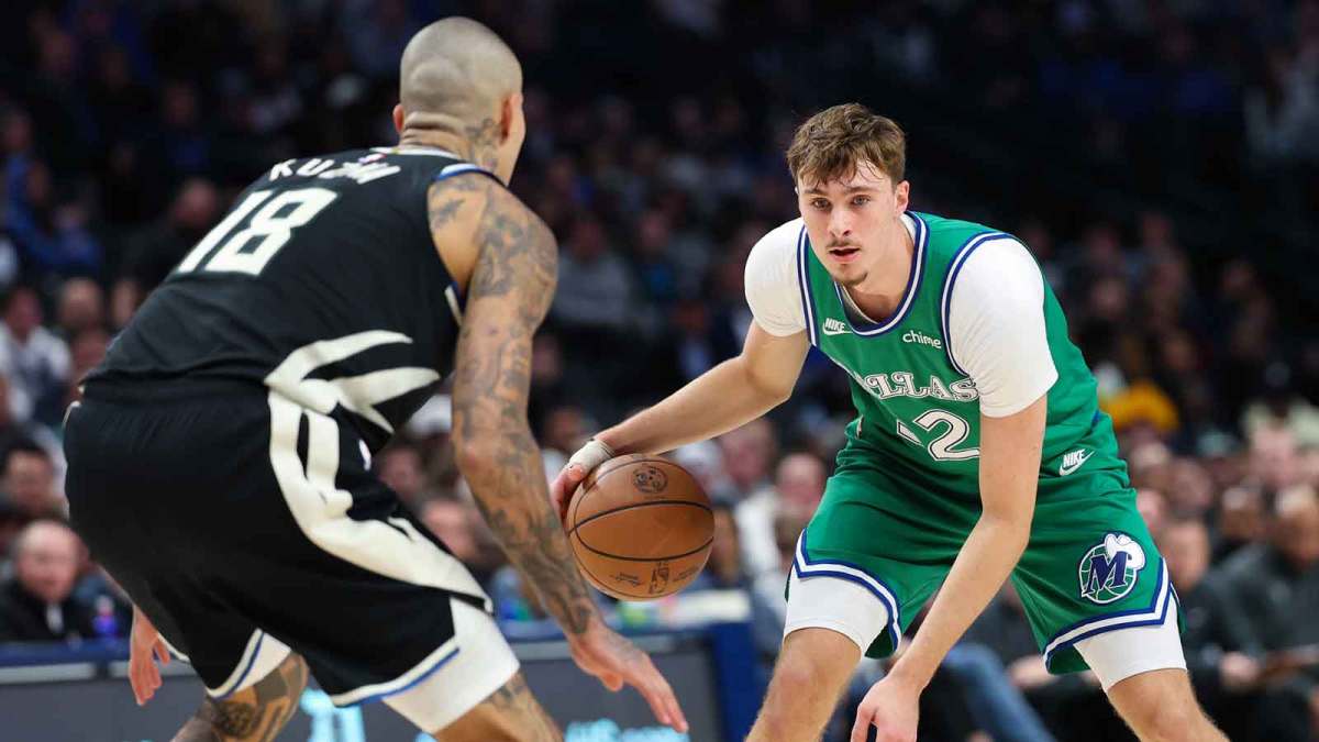 Dallas Mavericks forward Cooper Flagg (32) dribbles as Milwaukee Bucks forward Kyle Kuzma (18) defends during the third quarter at American Airlines Center.