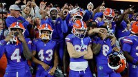 The Florida Gators celebrate their victory over the Florida State Seminoles at Ben Hill Griffin Stadium.