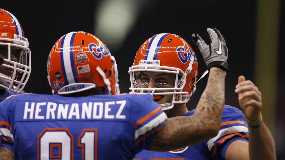 Florida Gators tight end Aaron Hernandez (81) celebrates with quarterback Tim Tebow (15) after scoring a touchdown against the Cincinnait Bearcats during the first half of the 2010 Sugar Bowl at the Louisiana Superdome.
