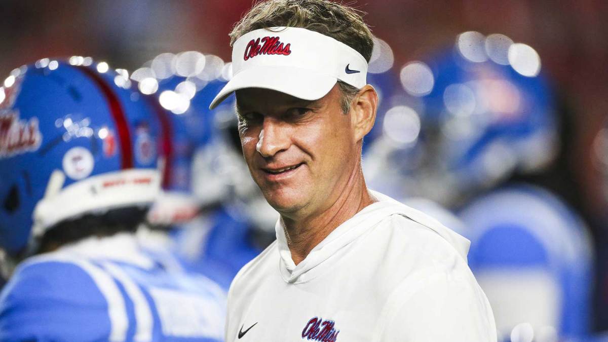Mississippi Rebels head coach Lane Kiffin watches pregame warmups against the Florida Gators at Vaught-Hemingway Stadium. Mandatory Credit: Petre Thomas-Imagn Images