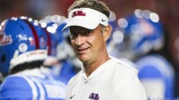 Mississippi Rebels head coach Lane Kiffin watches pregame warmups against the Florida Gators at Vaught-Hemingway Stadium. Mandatory Credit: Petre Thomas-Imagn Images