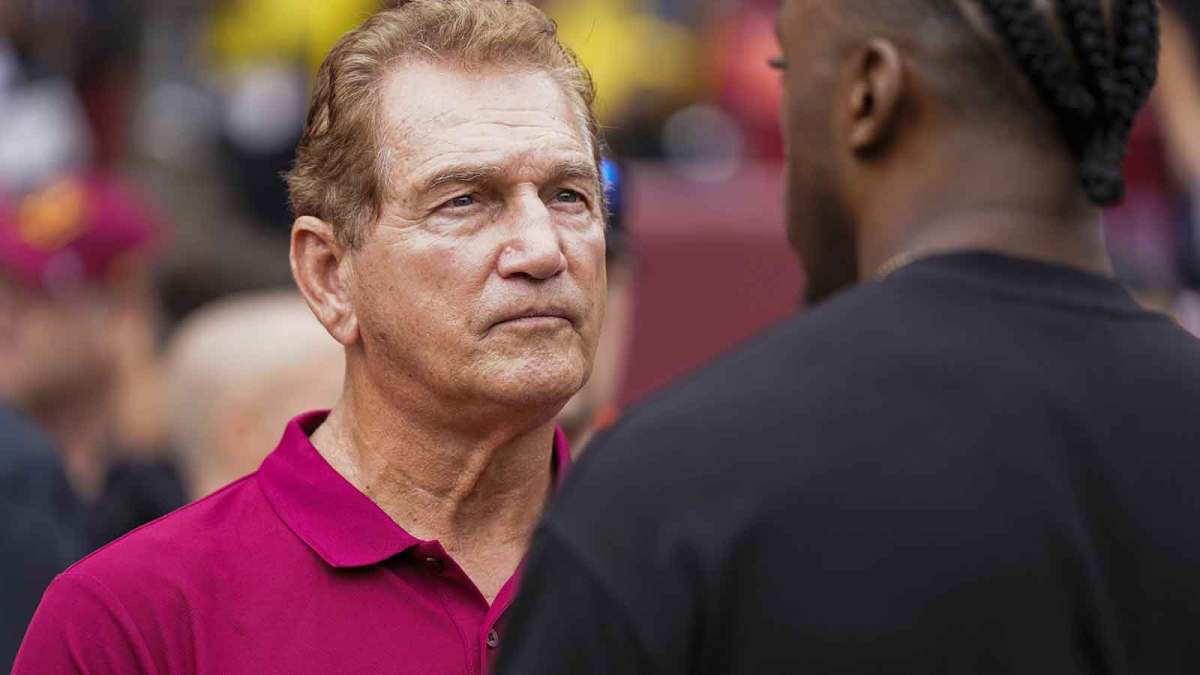 Former professional football players Joe Theismann (left) speaks with Robert Griffin III before the Washington Commanders and Arizona Cardinals game at FedExField.