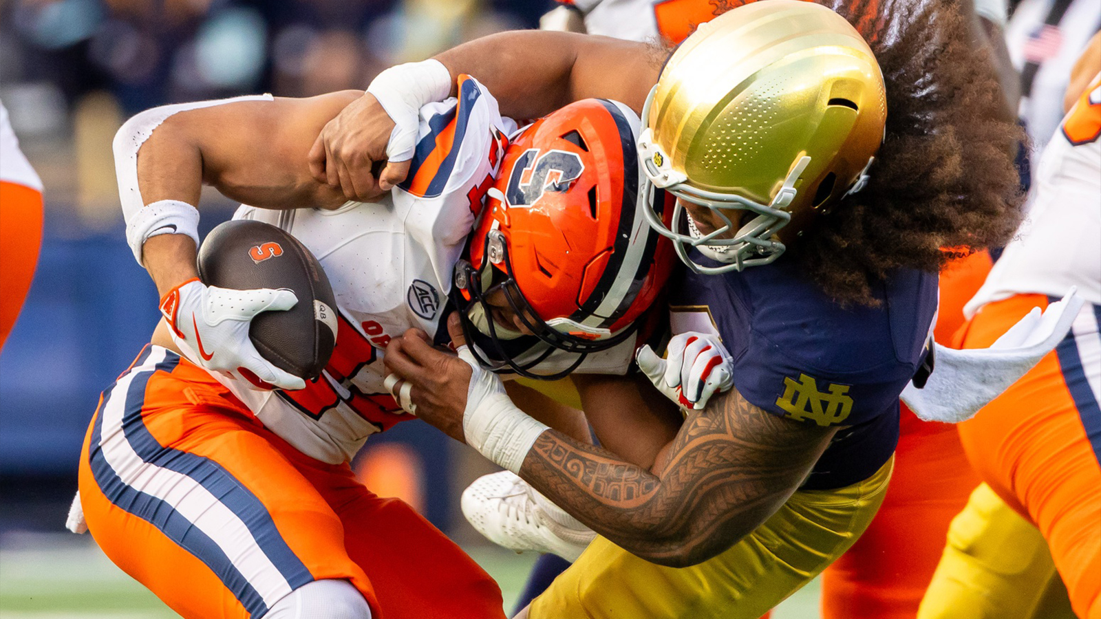 Notre Dame Fighting Irish defensive lineman Junior Tuihalamaka (44) hits Syracuse Orange running back Will Nixon (24) during the first half at Notre Dame Stadium.