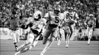 Spry Tennessee running back Frank Foxx (24) picks up some big yardages on a return as UCLA teammates Kenny Easley (5) and Don Hopwood (96) give chase. But the Vols fall 13-0 to UCLA before an opening record crowd of 85,897 at Neyland Stadium Sept. 16, 1978.