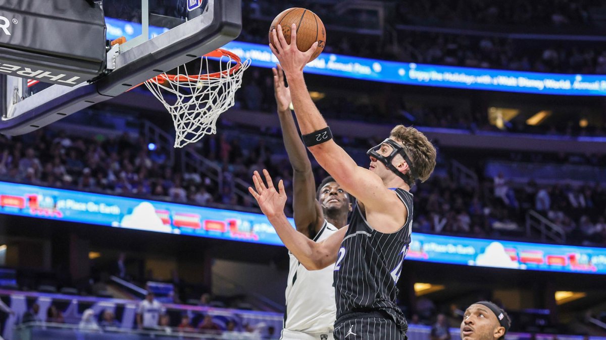 Nov 14, 2025; Orlando, Florida, USA; Orlando Magic forward Franz Wagner (22) goes to the basket against Brooklyn Nets guard Drake Powell (4) during the second half at Kia Center.