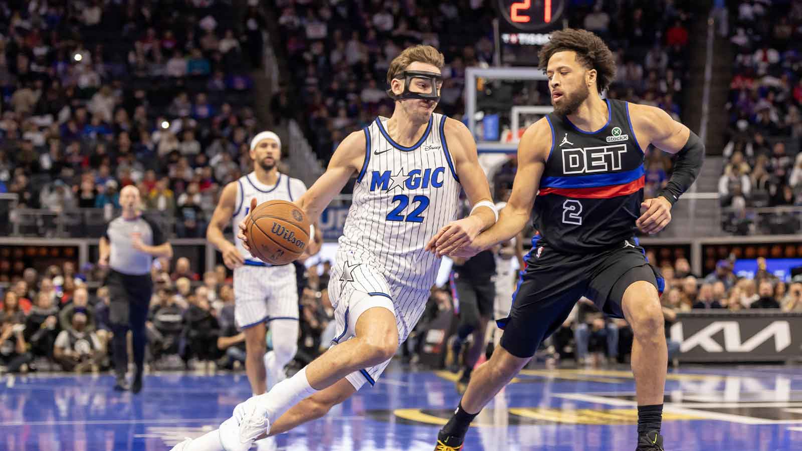 Orlando Magic forward Franz Wagner (22) drives to the basket as Detroit Pistons guard Cade Cunningham (2) defends during the first quarter at Little Caesars Arena.