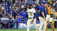 Milwaukee Brewers pitcher Freddy Peralta (51) leaves the mound as he is relieved by manager Pat Murphy (49) in the sixth inning during game two of the NLCS round against the Los Angeles Dodgers for the 2025 MLB playoffs at American Family Field.