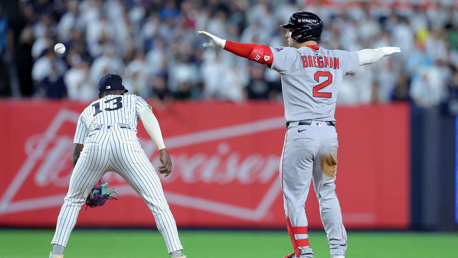 Boston Red Sox third baseman Alex Bregman (2) celebrates his RBI double against the New York Yankees during the ninth inning of game one of the Wildcard round of the 2025 MLB playoffs at Yankee Stadium.