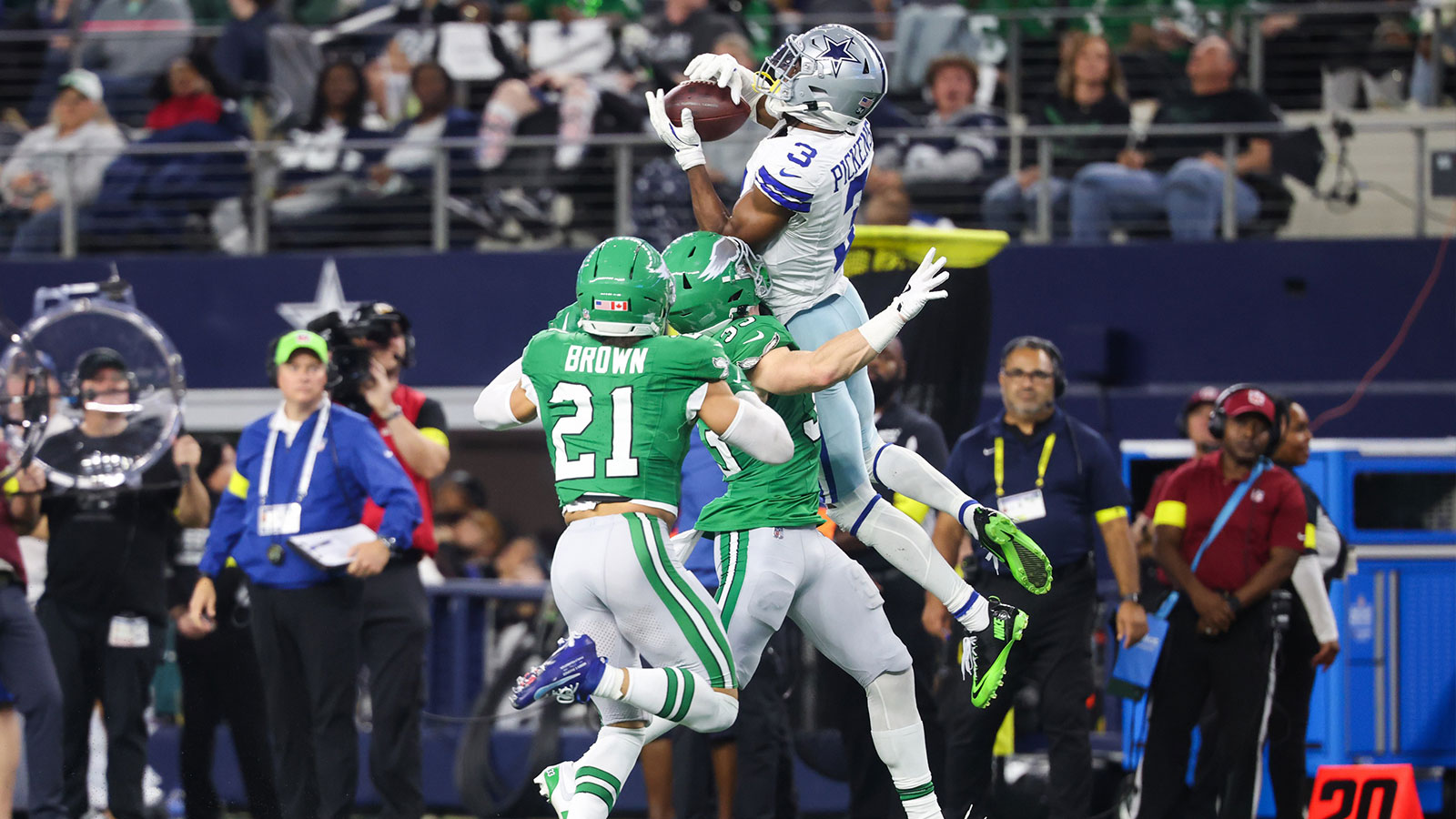 Dallas Cowboys wide receiver George Pickens (3) catches the ball while being defended by Philadelphia Eagles cornerback Cooper Dejean (33) in the fourth quarter at AT&T Stadium.