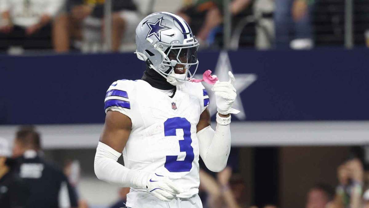 Dallas Cowboys wide receiver George Pickens (3) celebrates after scoring a touchdown in the fourth quarter against the Green Bay Packers at AT&T Stadium.