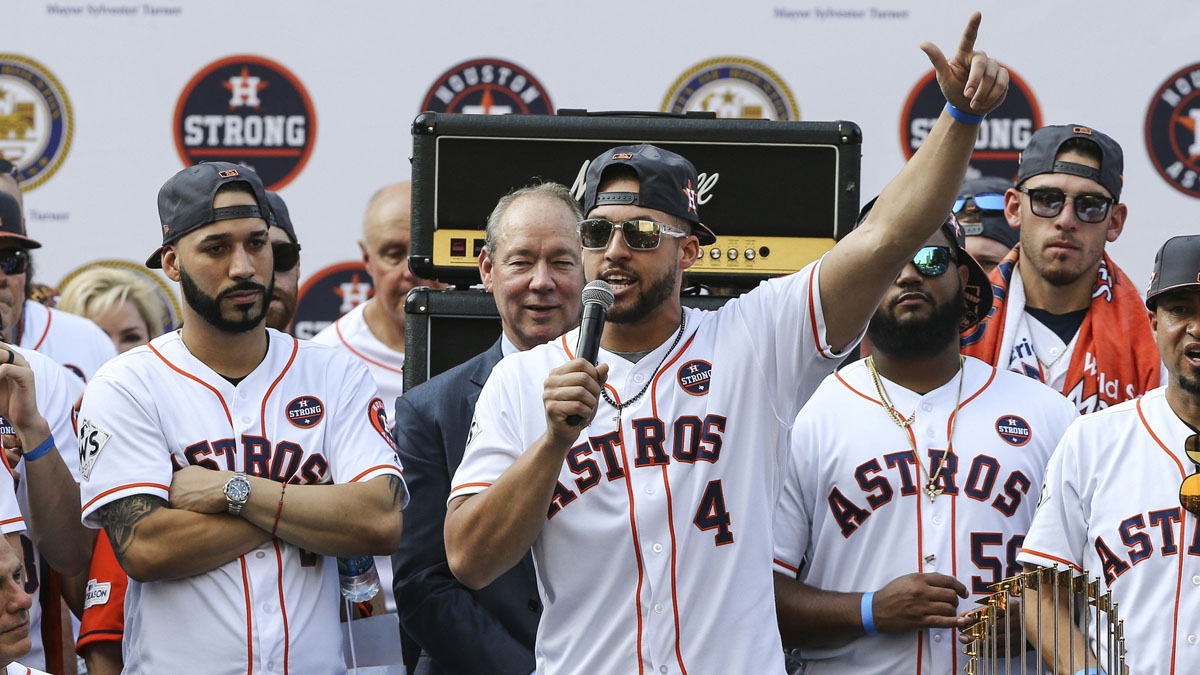 Houston Astros center fielder George Springer (4) talks to the crowd during the World Series championship parade and rally at Houston City Hall.