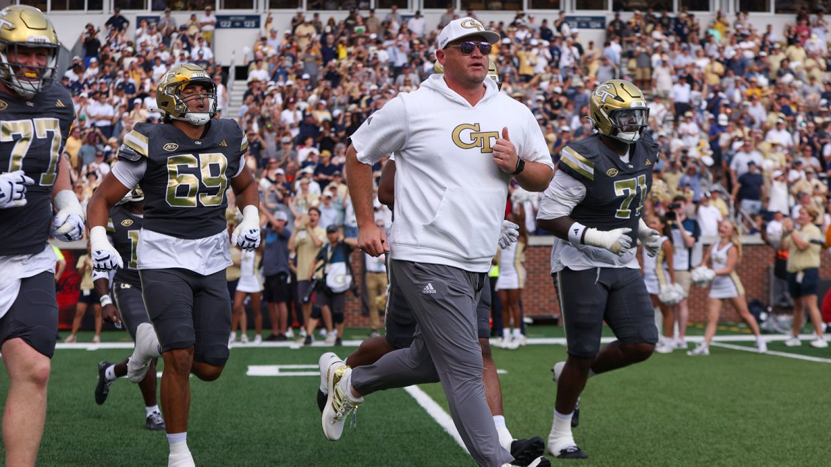Georgia Tech Yellow Jackets head coach Brent Key runs on the field before a game against the Temple Owls at Bobby Dodd Stadium at Hyundai Field.