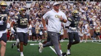 Georgia Tech Yellow Jackets head coach Brent Key runs on the field before a game against the Temple Owls at Bobby Dodd Stadium at Hyundai Field.