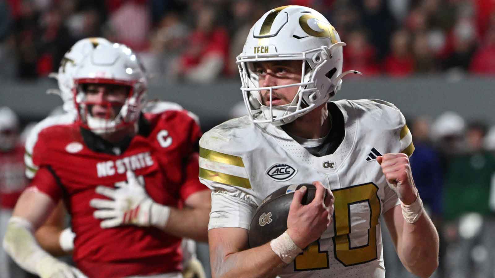 Georgia Tech Yellow Jackets quarterback Haynes King (10) reacts after scoring a touchdown during the fourth quarter at Carter-Finley Stadium.