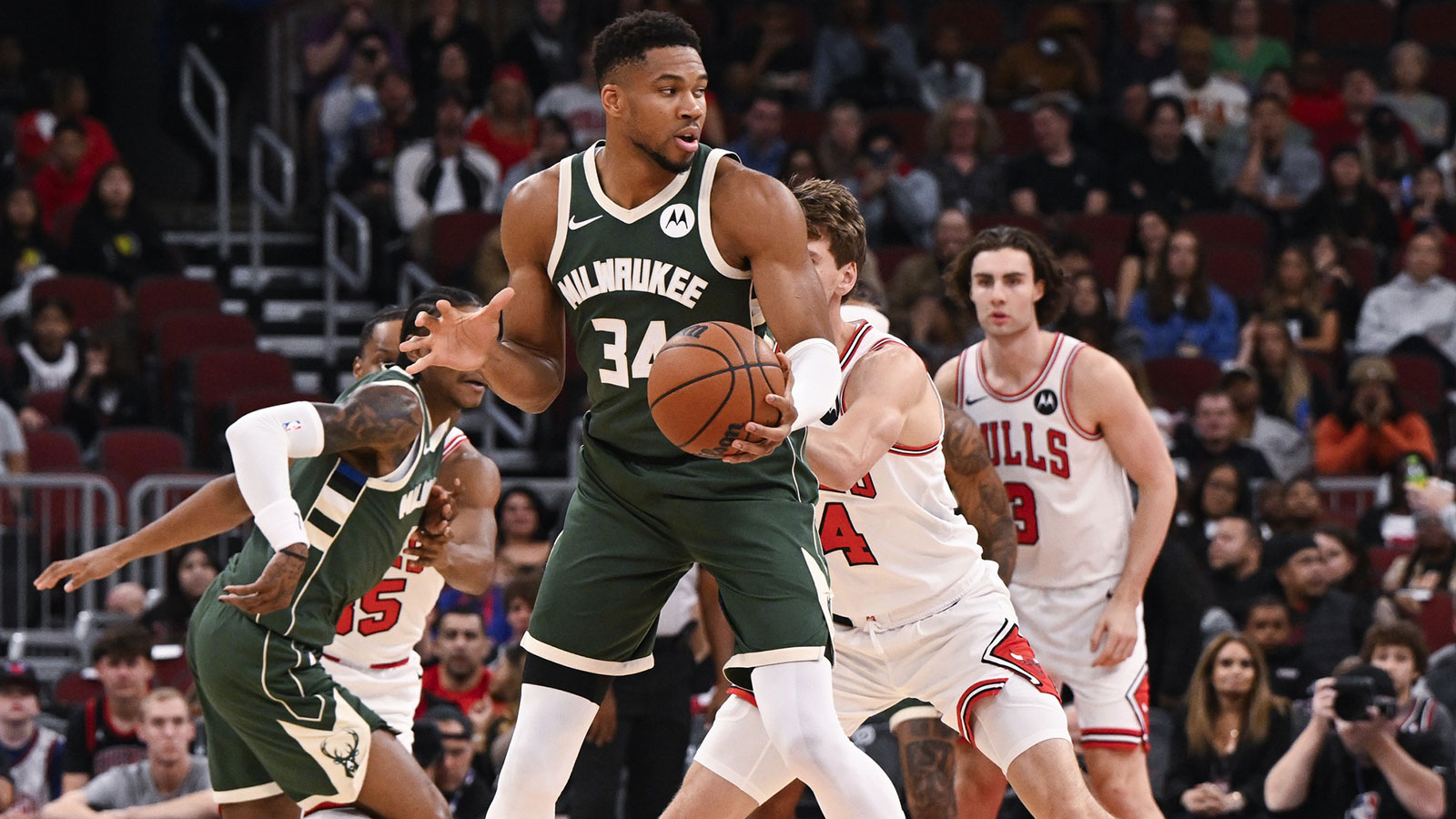 Milwaukee Bucks forward Giannis Antetokounmpo (34) grabs the ball against the Chicago Bulls during the first half at the United Center.