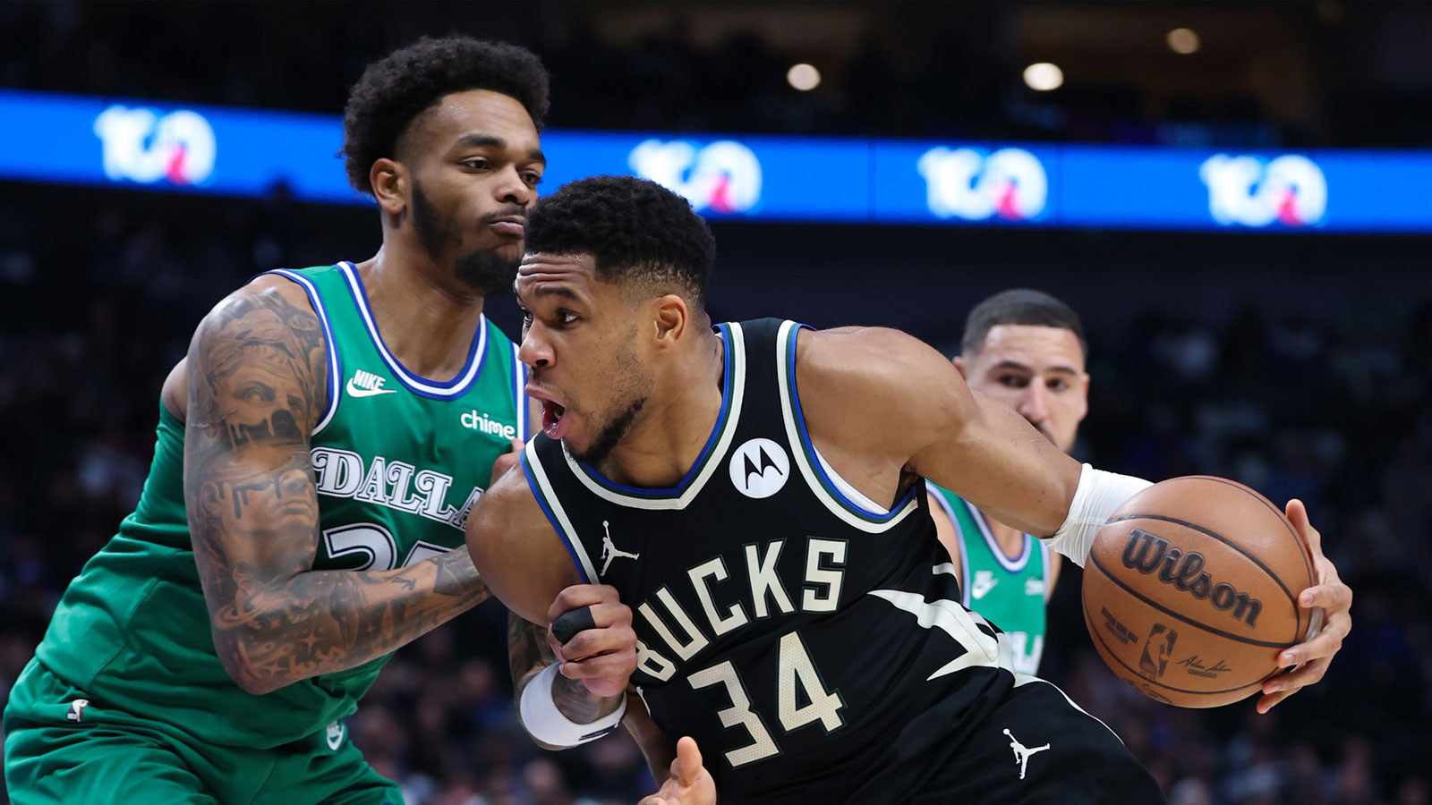Milwaukee Bucks forward Giannis Antetokounmpo (34) drives to the basket as Dallas Mavericks forward P.J. Washington (25) defends during the first quarter at American Airlines Center.